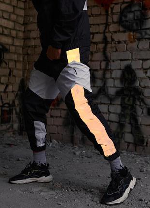 Теплые спортивные штаны split черно-белые с рефлективом1 фото