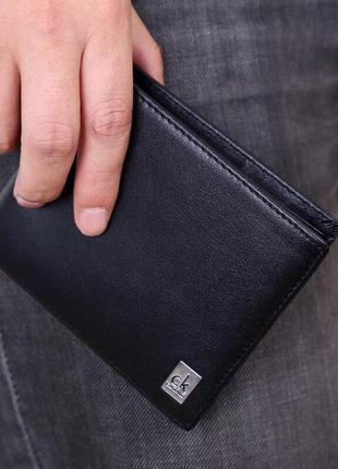 Мужской кожаный кошелек calvin klein черный портмоне на подарок1 фото