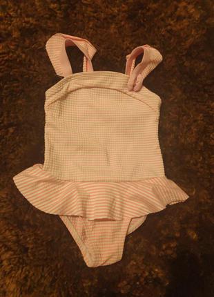 Детский купальник розовый из пупырчатой ткани.