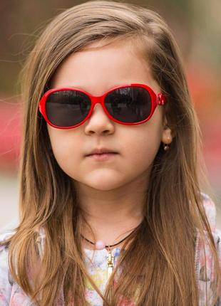 Солнцезащитные очки детские в пластиковой оправе с поликарбанатной линзой красные3 фото
