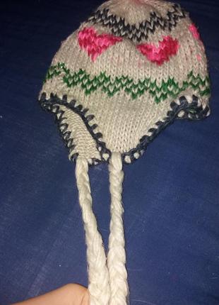 Зимняя вязаная шапка с косичками4 фото