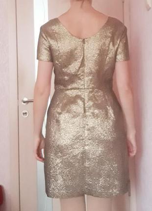 Платье-мини золотистое с 2- мя бантами на талии2 фото