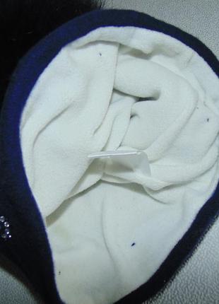 Тёплая шапка на флисовой подкладке с натуральным бубоном7 фото