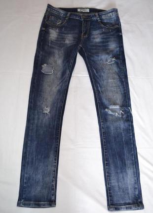 Стильные рваные джинсы, италия. хл2 фото