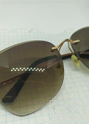 Солнцезащитные очки с камнями на дужках1 фото