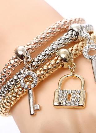 Набір з трьох браслетів з підвісками "замок і ключик" золото,срібло,бронза7 фото