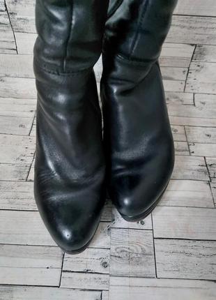 Зимние женские кожаные сапоги shidalis черные на танкетке7 фото