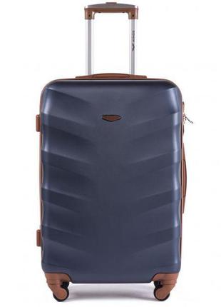 Велика пластикова дорожня валіза на колесах wings 402 темно-синього кольору розмір l містка валіза3 фото
