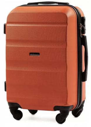 Дорожный яркий чемодан оранжевый на 4 колесах пластиковый wings at01 размер s ручная кладь1 фото