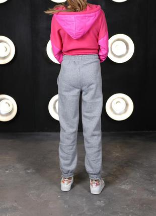 Стильні теплі дитячі спортивні штани утеплені на флісі підліткові спортивні штани на флісі зимові спортивні штани для дівчинки3 фото