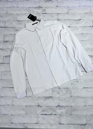 Біла трикотажна сорочка sorbino