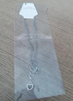 Ожерелье-чокер с подвеской сердечками6 фото