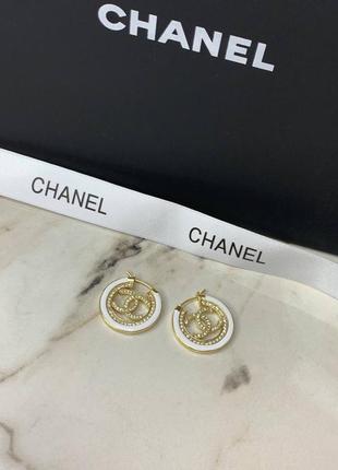 Брендовые круглые серьги в цирконии с позолотой