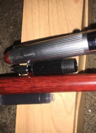 Пір'яна ручка в дерев'яному корпусі і пеналі3 фото