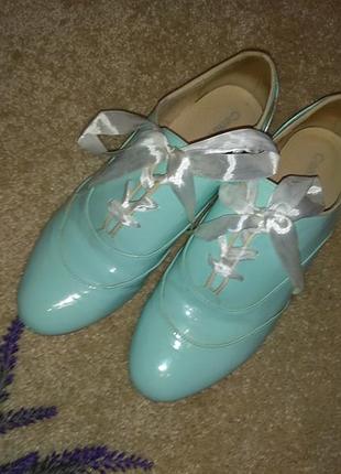 Туфлі на шнурівці з бантами