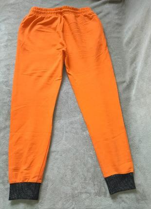 Классные спортивные штаны яркого апельсинового цвета2 фото