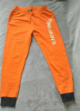 Классные спортивные штаны яркого апельсинового цвета1 фото