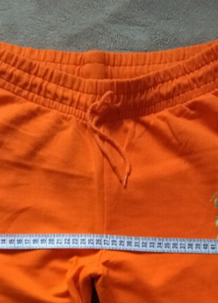 Классные спортивные штаны яркого апельсинового цвета9 фото