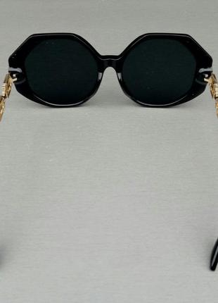 Versace стильные женские солнцезащитные очки большие черные с золотыми логотипами5 фото
