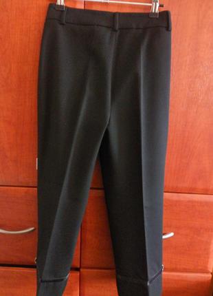 Укороченные брючки bolero с лампасами 40 размер {l}