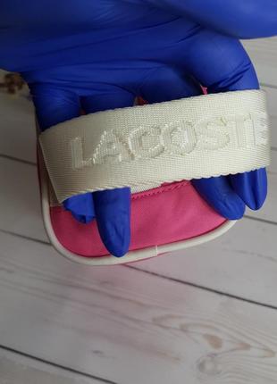 Спортивна і стильна сумочка lacoste з дуже практичною нейлонової тканини під рогожку3 фото