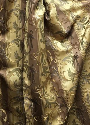 Портьерная ткань для штор жаккард коричневого цвета с вензелями