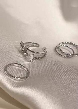 Набір колечок стильні модні трендові сріблясті колечка кільця перстні каблучки із метеликом вишукані кільця в стилі бохо