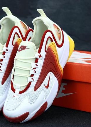 Чоловічі кросівки білі з помаранчевим.