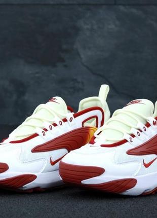 Чоловічі кросівки білі з помаранчевим.