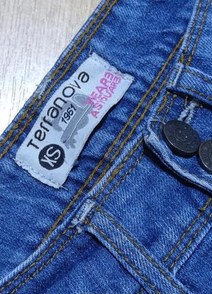 Узкие джинсы с потертостями и дырами.3 фото