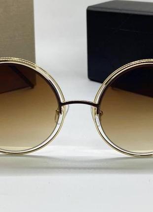 Стильні сонцезахисні окуляри d*or коричневі кругляшки2 фото