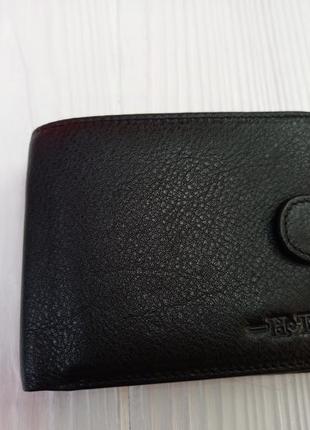 Мужской черный кожаный кошелёк на кнопке1 фото