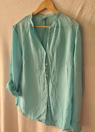 Винтажная шикарная новая шелковая блуза небесно голубого цвета.1 фото