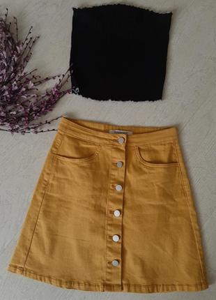 Стильна джинсова спідниця на гудзиках