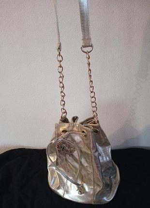 Сумка -мішок золотистого кольору від відомого бренду