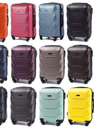 Дорожный пластиковый чемодан на колесах wings 147 white размер xs мини для ручной клади из поликарбоната5 фото