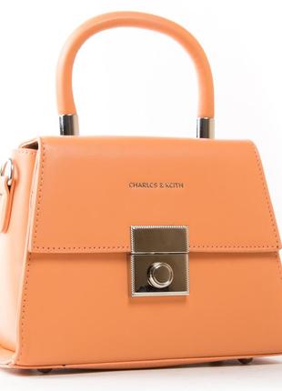 Стильна жіноча помаранчева сумка з короткою ручкою і ременем
