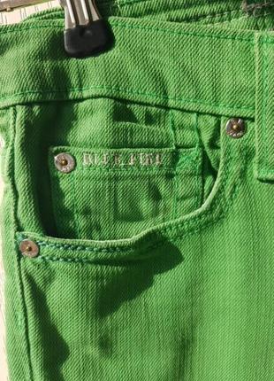 Яркие зеленые джинсы эко7 фото