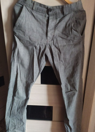 Стильные джинсы-брюки в клетку на резинке внизу