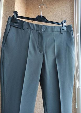 Классические качественные серые брюки зауженные к низу2 фото