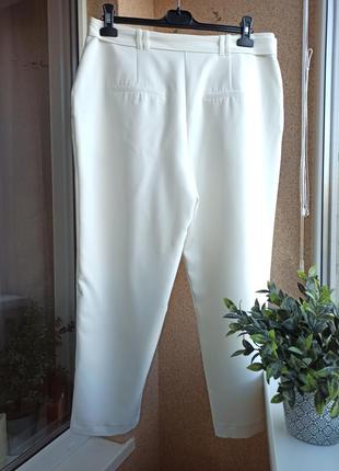 Стильні літні брюки молочного кольору вільного силуету з поясом завужені до низу3 фото