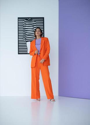 Классический женский костюм в деловом стиле брюки и пиджак, оранжевый 44, 46, 48, 504 фото