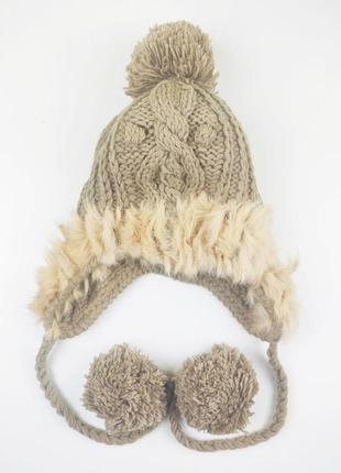 Женская шапка ушанка вязаная бежевая с мехом и помпонами на завязках2 фото