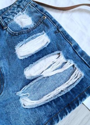 Блакитні щільні джинсові шорти з фабричними рваностями на високій посадці4 фото