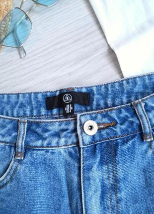 Блакитні щільні джинсові шорти з фабричними рваностями на високій посадці3 фото