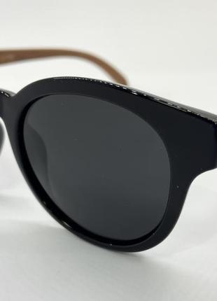 Солнцезащитные круглые очки поляризованные в пластиковой оправе с деревянными дужками2 фото