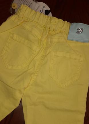 Яскраві жовті джинси для дівчинки італія 6 - 9 міс3 фото