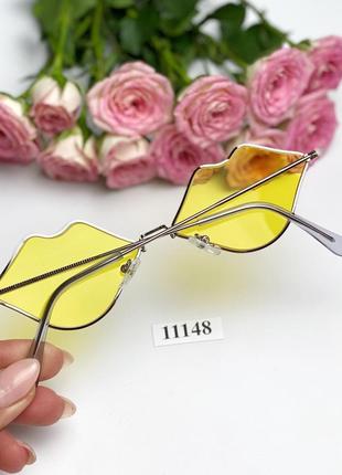Сонцезахисні окуляри у вигляді губ з жовтими лінзами к. 111486 фото