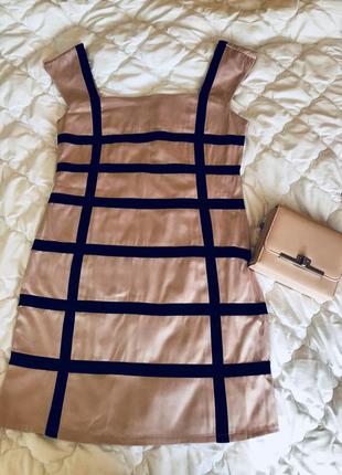 Бежеву сукню з чорними вставками