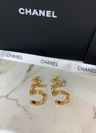 Брендові стильні сережки з дрібними каменями золотого кольору7 фото